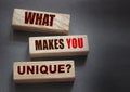 What makes you unique - phrase on Wooden blocks. Business or career success concept Royalty Free Stock Photo