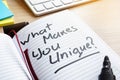 What Makes You Unique? written in a note. Royalty Free Stock Photo