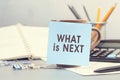 What is Next - concept of text on sticky note. Work and study concept Royalty Free Stock Photo