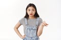 So what not care. Reluctant brunette asian girlfriend shrugging raise hand full disbelief dismay questioned look camera Royalty Free Stock Photo