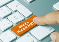 What`s Happening? - Inscription on Orange Keyboard Key