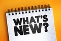 What`s New question text on notepad, concept background Royalty Free Stock Photo