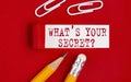 WHAT`S YOUR SECRET message written under torn red paper with pencils and clips, business concept Royalty Free Stock Photo
