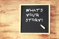 What's your story concept written on blackboard Royalty Free Stock Photo