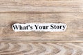 WHAT'S YOUR STORY text on paper. Word WHAT'S YOUR STORY on torn paper. Concept Image Royalty Free Stock Photo