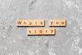 What`s your story word written on wood block. What`s your story text on cement table for your desing, Top view concept Royalty Free Stock Photo