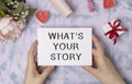 What`s Your Story, written on a card in hands Royalty Free Stock Photo