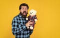 what a surprise. happy man holding teddy bear. cheerful man in checkered shirt with bear toy. feel of happiness and joy Royalty Free Stock Photo