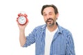 What time is it. Bearded senior man with mechanical clock in hand. Mature timekeeper with analog clock. Mature man