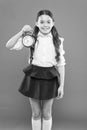 What time is it. time to go to school. Children education. Knowledge day. Happy girl hold alarm clock counting for lunch Royalty Free Stock Photo