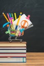 What to buy for Back to school supplies in shopping cart Royalty Free Stock Photo