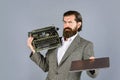 What to choose. mature man hold vintage device. first draft. professional typist make notes. modern and old technology Royalty Free Stock Photo