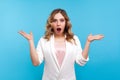 What? Unbelievable! Portrait of amazed woman looking with mouth open in surprise. isolated on blue background Royalty Free Stock Photo