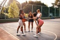 This is what were going to do. a diverse group of friends getting ready to play a game of basketball together during the Royalty Free Stock Photo