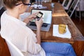 What would we do without technology. Rear view shot of a beautiful young woman working from home. Royalty Free Stock Photo