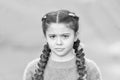 What is wrong. Hairdresser salon. Braided cutie. Little girl with cute braids close up. Kanekalon strand in braids of