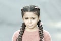 What is wrong. Hairdresser salon. Braided cutie. Little girl with cute braids close up. Kanekalon strand in braids of