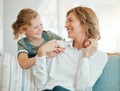 What you doing grandma. an adorable little girl hugging her grandmother during a day at home. Royalty Free Stock Photo