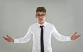 What are you looking at. A young man wearing glasses gesturing at the camera. Royalty Free Stock Photo