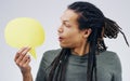 So is that what you meant all along. a handsome young man holding a speech bubble against a grey background. Royalty Free Stock Photo