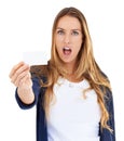 What. A young woman looking shocked while holding a blank businesscard. Royalty Free Stock Photo