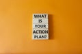 What is your action plan symbol. Wooden blocks with words What is your action plan. Beautiful orange background. Business and What Royalty Free Stock Photo