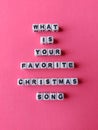 What is your favorite Christmas song poster on a pink background