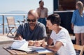 What are your thoughts on the matter. two confident young businesspeople having a meeting together while making use of a Royalty Free Stock Photo