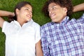 Whatever happens, well do it together. a happy young couple gazing into each others eyes on the lawn. Royalty Free Stock Photo