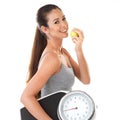 Whatever the question, the answer is always apples. Studio portrait of an attractive young woman holding an apple and a