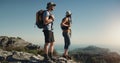 Whatever the question hiking is the answer. a man and woman hiking up a mountain.