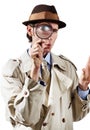 Whats this I see. Curious private investigator looking through a magnifying glass against a white background. Royalty Free Stock Photo