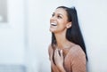 Whats life without the laughter. a happy and attractive young woman leaning against a wall outside. Royalty Free Stock Photo