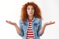 Whats point. Perplexed worried redhead confused young silly girlfriend wide eyes shrugging hands spread sideways puzzled
