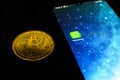 WhatsApp application on smartphone and bitcoin cryptocurency. WhatsApp launches cryptocurrency payments