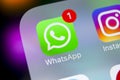 Whatsapp messenger application icon on Apple iPhone X smartphone screen close-up. Whatsapp messenger app icon. Social media icon. Royalty Free Stock Photo