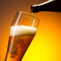 Wheat beer flows in to a glass Royalty Free Stock Photo