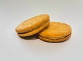 Wheat biscuit sandwich with peanut butter in the center on a white background Royalty Free Stock Photo