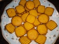 Wheat biscuits in the plate with blury background. BISCUITS - A stack of delicious wheat round biscuits . Chai-biscuit in India.
