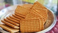 Wheat biscuits in the steel plate with blur background. Indian biscuits popularly known as Chai-biscuit in India