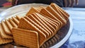 Wheat biscuits in the steel plate with blury background. Indian biscuits popularly known as Chai-biscuit in India