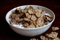 Wheat bran breakfast cereal in bowl. Royalty Free Stock Photo