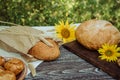Wheat bread with flax seeds, buns or pies, sunflower on a brown wooden background, home baking 2 Royalty Free Stock Photo