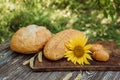 Wheat bread with flax seeds, buns or pies, sunflower on a brown wooden background, home baking 3 Royalty Free Stock Photo