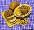 Wheat bread products are on blue tartan Royalty Free Stock Photo