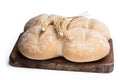 Wheat bread rolls on a cutting board isolated on white Royalty Free Stock Photo