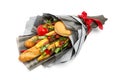 Wheat bread, sesame bun, cheese of different varieties, sausages and pepper are wrapped in gray paper as a gift bouquet on a white