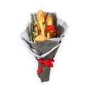 Wheat bread, sesame bun, cheese of different varieties, sausages and pepper are wrapped in gray paper as a gift bouquet on a white Royalty Free Stock Photo