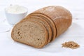 Wheat bread slice slices sliced loaf on wooden board Royalty Free Stock Photo