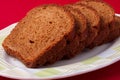 Wheat brown bread slices on white background Royalty Free Stock Photo